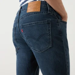 512™ Mid-Rise Slim Tapered Jeans