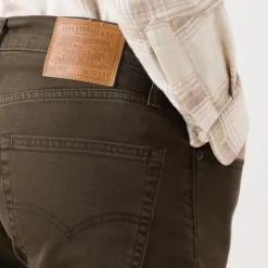 502™ Mid-Rise Tapered Jeans