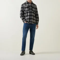 502™ Mid-Rise Tapered Jeans