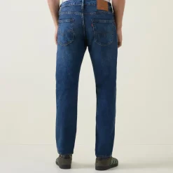 502™ Mid-Rise Tapered Jeans
